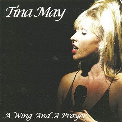 "Tina May album cover featuring a blonde woman singing into a microphone."
