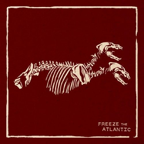 Brown album cover with white dinosaur skeleton and "Freeze the Atlantic" text.