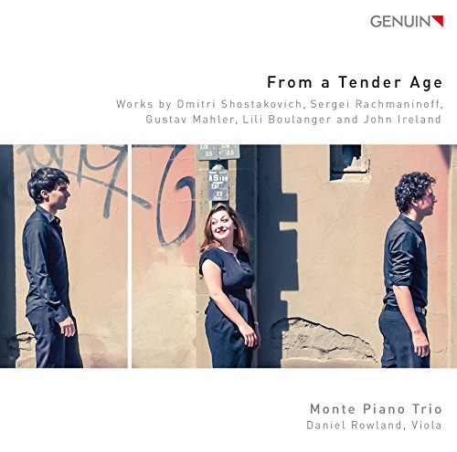 "CD cover with three musicians standing against a wall, dressed in dark attire."