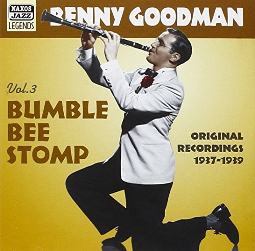 Benny Goodman playing clarinet on one knee, on a jazz album cover.