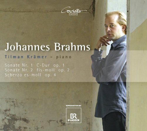 CD cover with a man in a doorway, leaning on a doorframe, looking contemplative.