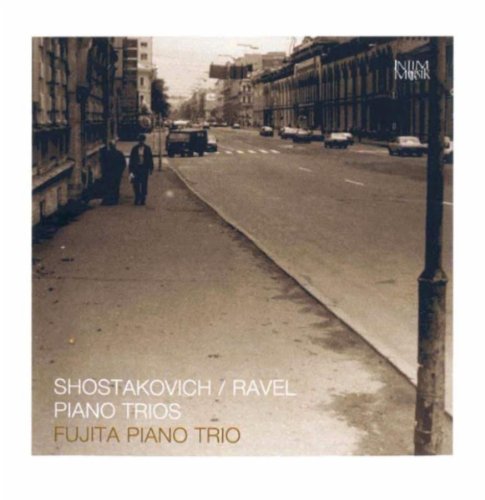 A sepia-toned city street scene on a CD cover with white and gold text.