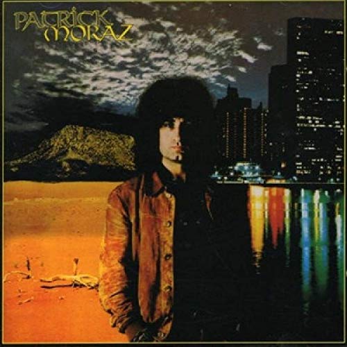 "Album cover featuring a man with long hair standing in front of a city skyline."
