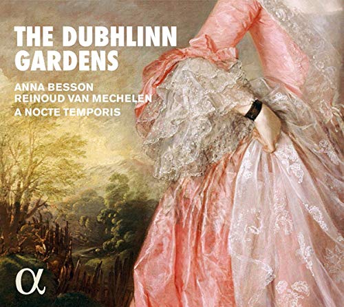 "CD cover featuring a woman in a pink dress against a landscape background."