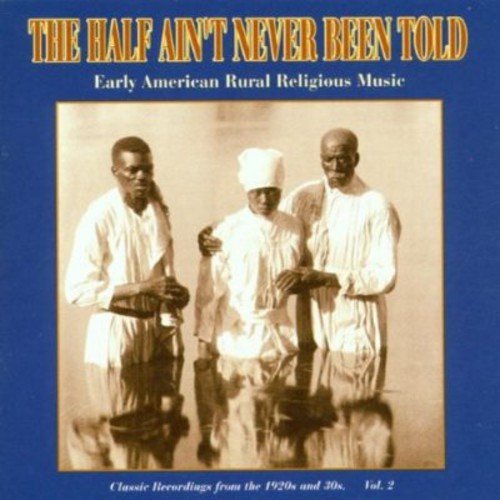 "CD cover with sepia-toned image of three men in white robes on blue background."