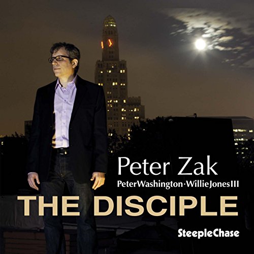 Album cover with a man standing in front of a city skyline at night.