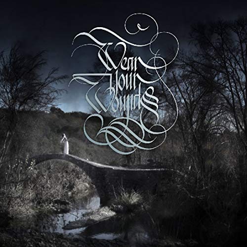 Vinyl record with dark album cover featuring a figure on a bridge.