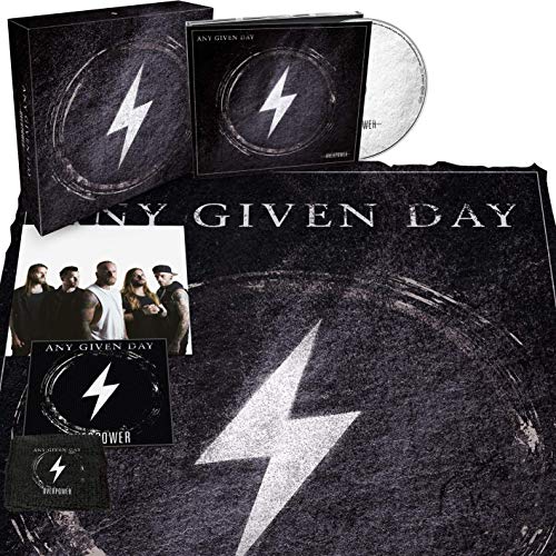 "CD packaging with a black box, disc, and inserts featuring a white lightning bolt logo."