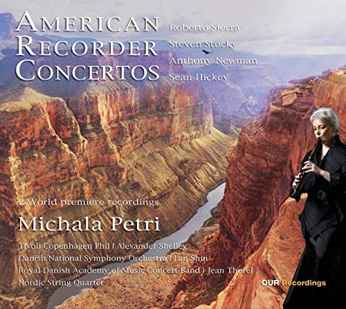 CD cover featuring a woman playing recorder on a cliffside with canyon landscape.