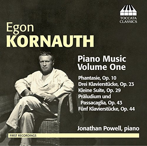 CD cover with a man sitting in a wicker chair, dark background, text listing piano compositions.