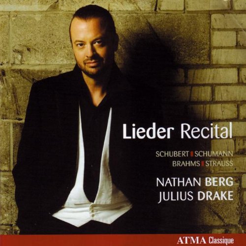 "CD cover featuring a man in a tuxedo against a brick wall."