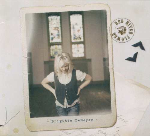"Vintage-style album cover with a blonde woman standing in a room."