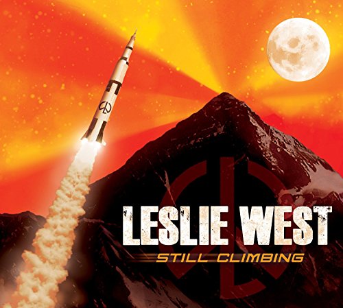 "Album cover featuring a rocket blasting off towards the moon, with 'Leslie West Still Climbing' text."