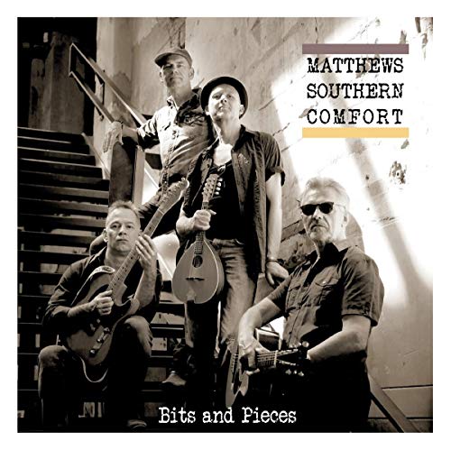 "Black and white vinyl record cover featuring four men with guitars on a staircase."