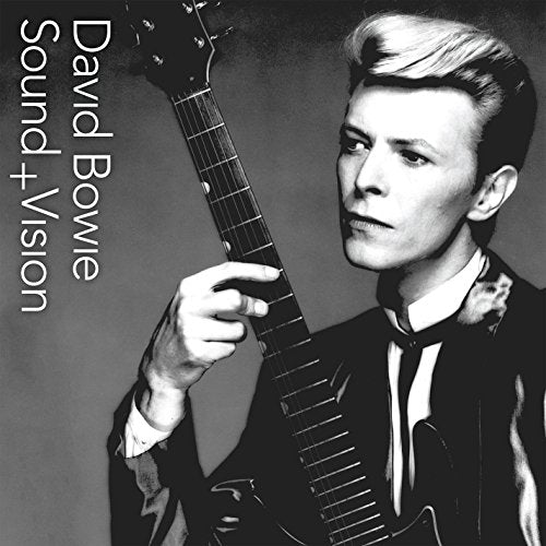Black and white David Bowie CD cover with musician holding a guitar.