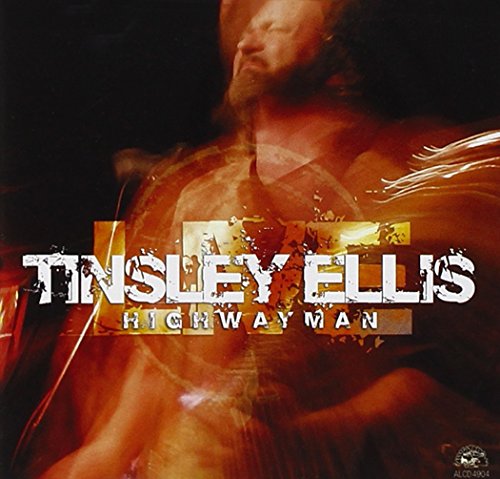 "CD cover with Tinsley Ellis performing, blurred motion, orange and black background."
