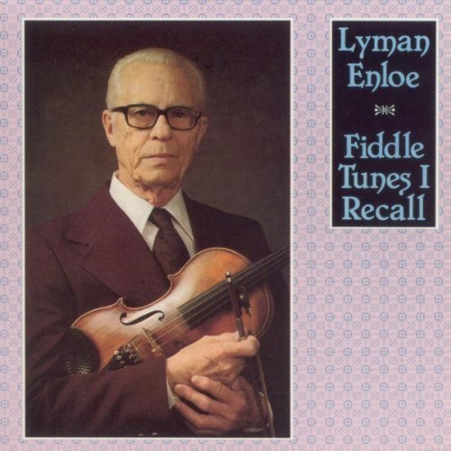 Album cover with a man holding a violin, wearing a suit and tie.