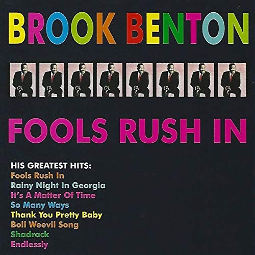 "CD cover with black background, multicolored text, and a row of man in suit."