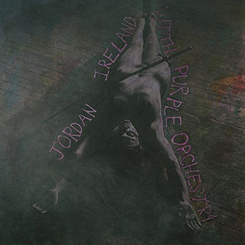 "Vinyl record cover featuring a dark image of a man falling with purple text."