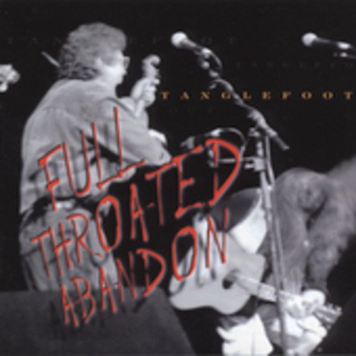 "Album cover with black and white photo of musician on stage, text overlay."