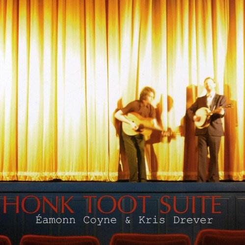 "CD cover featuring two men on stage playing instruments with yellow curtains."