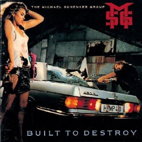 Album cover featuring a woman and man beside a damaged silver car at night.