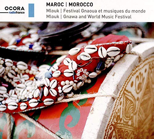 "CD cover featuring a close-up of a decorated drum with white cowrie shells."