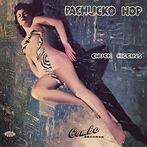 "Album cover with a woman in a zebra-print bikini posing on a rock."