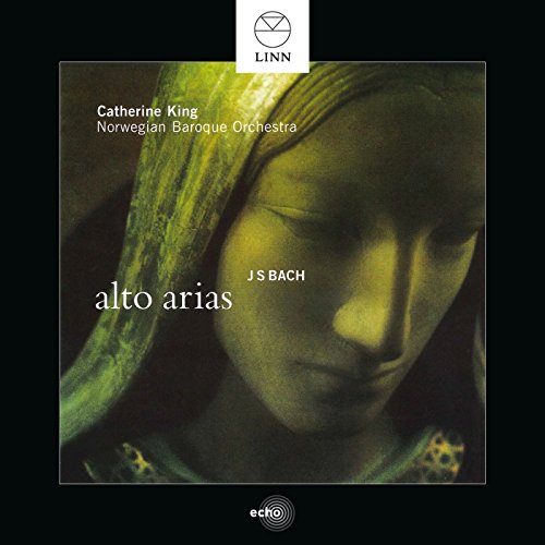 CD cover featuring a woman's face with headscarf, with white text on black background.