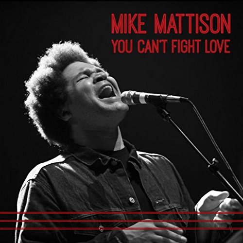 "Album cover with a man singing into a microphone, red text on black background."