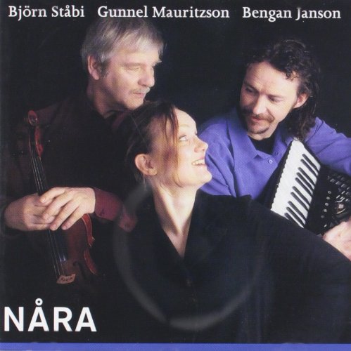 Album cover featuring three musicians with instruments against a dark background.