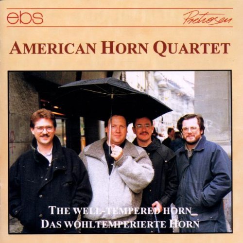 "CD cover with four men under an umbrella, beige background, red and white text."