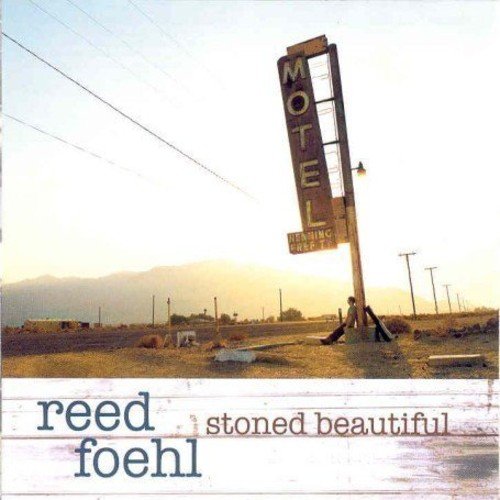 "Album cover featuring a worn motel sign in a desert landscape."