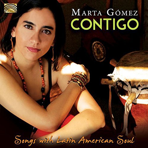 Marta Gomez album cover featuring a woman with dark hair and traditional Latin jewelry.