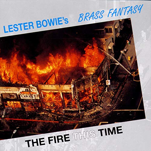 CD album cover with a burning building and debris, titled "The Fire This Time".