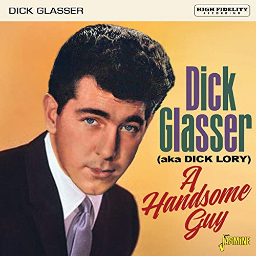 CD cover featuring a man in a suit against a yellow background.