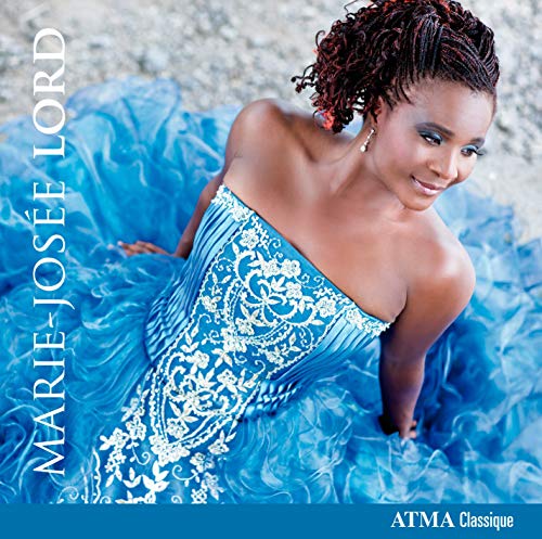 "CD cover featuring a woman in a blue dress with white floral patterns."