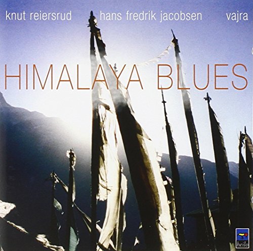 "Album cover featuring prayer flags in the wind against a mountainous backdrop."