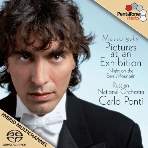 A man in a tuxedo on a blue album cover with text and logos.
