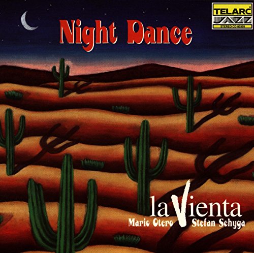 "Album cover for 'Night Dance' by la Vienta, featuring a desert landscape with cacti and a crescent moon."