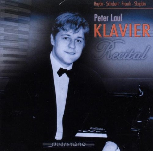 "CD cover featuring a man in a tuxedo with piano-related text."
