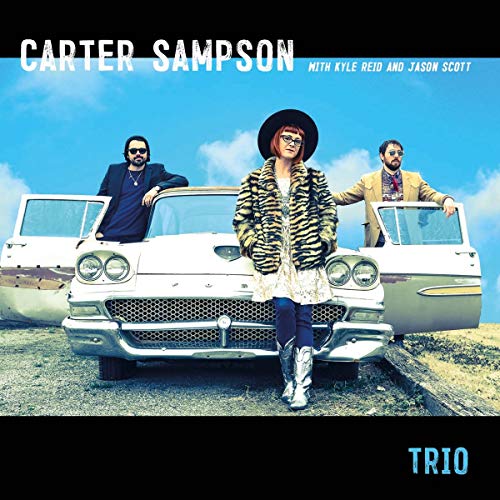 Album cover featuring a woman in a hat and fur coat standing by a vintage car.