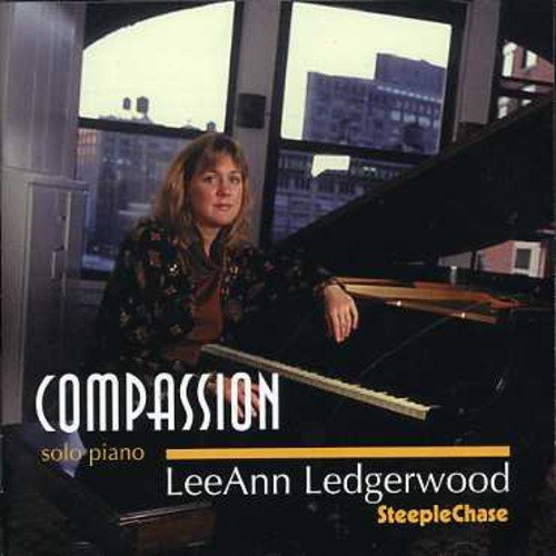 "Blurry image of a woman sitting at a piano with 'Compassion' and 'LeeAnn Ledgerwood' text."