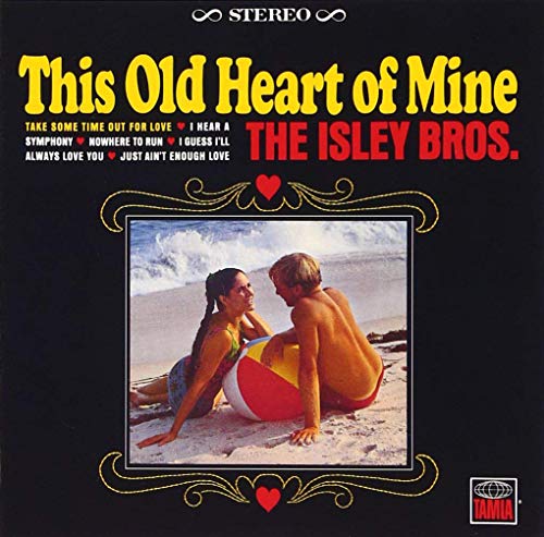Vinyl album cover featuring a couple on the beach, surrounded by ornate design.