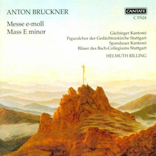 "CD cover featuring a rocky landscape with a cross on a peak."