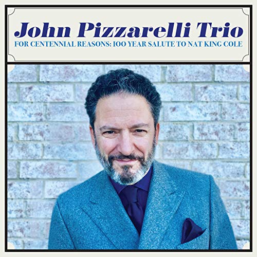 Album cover featuring a man in a blue suit against a brick wall.