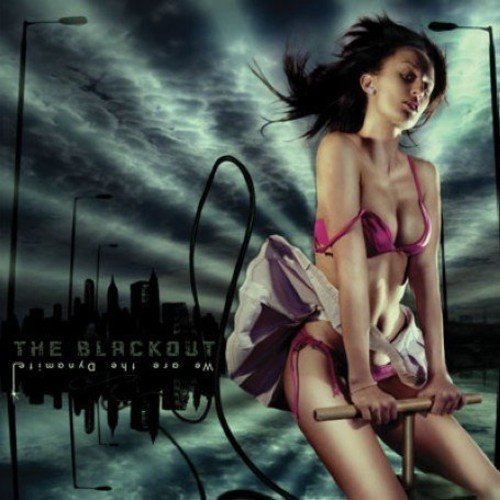 A woman in a purple bikini sits on a swing against a city skyline.