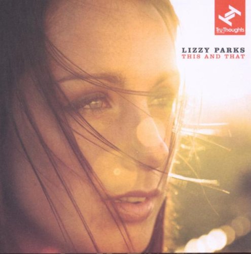 The alt text for the image is: "Album cover with a close-up of a woman's face."