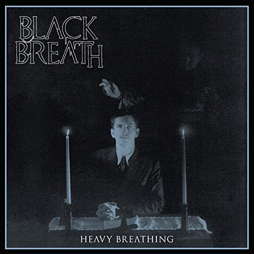 Album cover featuring a man in a suit with a ghostly figure behind him.