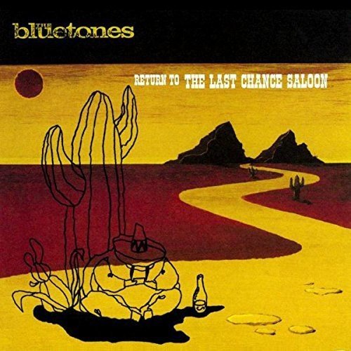 "Album cover art featuring a desert scene with a man sitting by a cactus."
